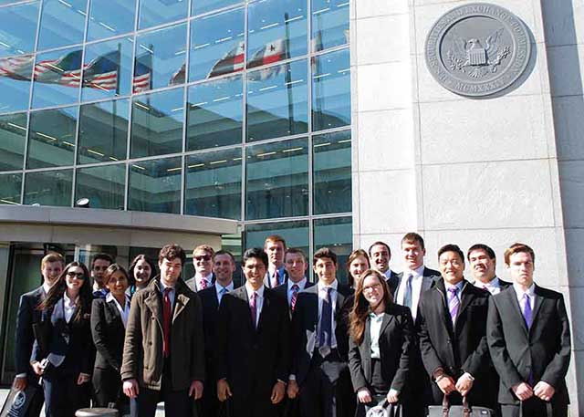 University students participating in the Regulatory Outreach for Student Education (ROSE) standing together outside the SEC building. Center for the Study of Financial Market Evolution (CSFME).